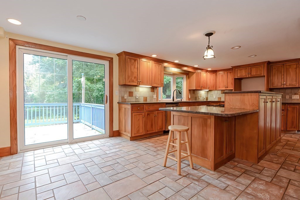 12 Ridgeview Road Sturbridge, MA 01566 - Photo 7 of 40 a kitchen with stainless steel appliances granite countertop a stove a sink and a refrigerator