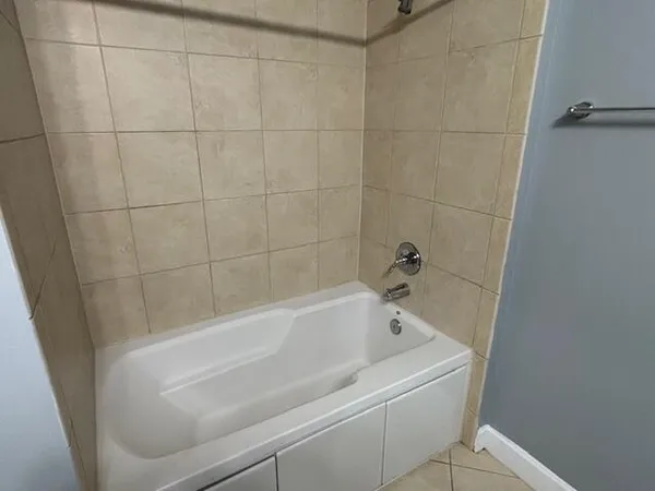 a view of basketball area with wooden fence