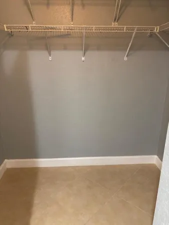 a room with gym equipment and a large window