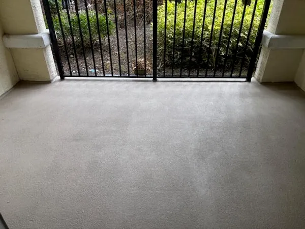 a view of a workspace with furniture and a flat screen tv