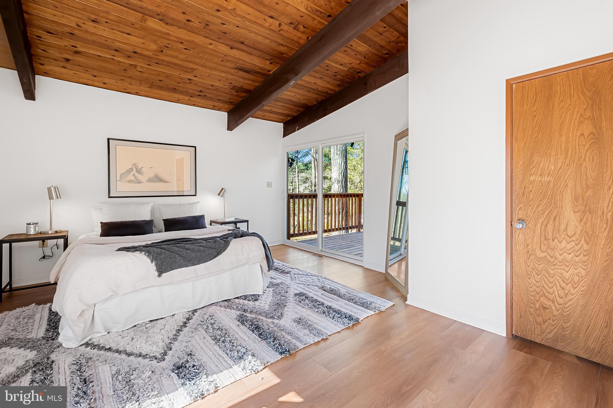 1817 Falls Road Parkton, MD 21120 - Photo 17 of 50 a large bed sitting in a bedroom next to a window