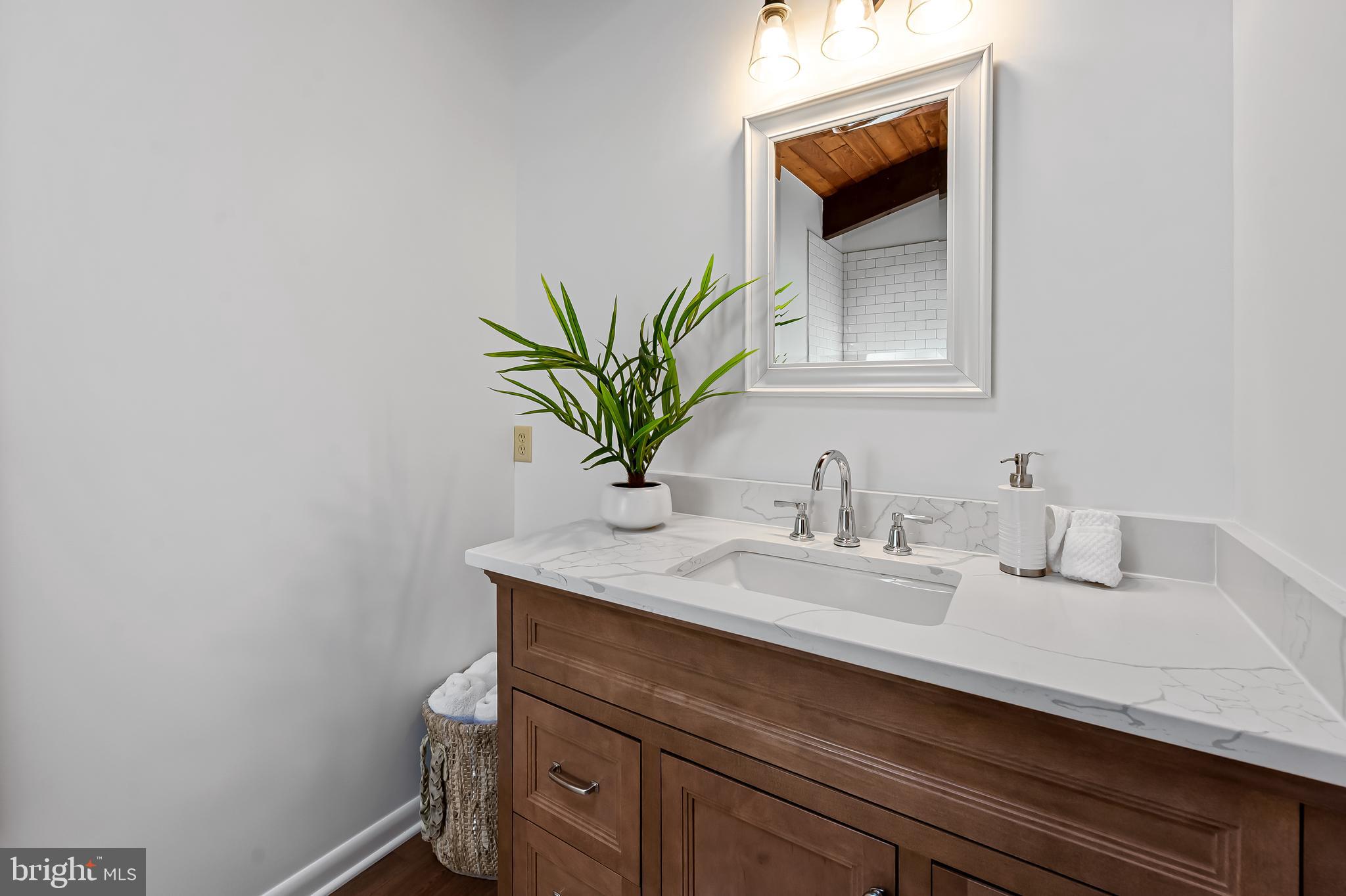 1817 Falls Road Parkton, MD 21120 - Photo 21 of 50 a bathroom with a sink a vanity and a mirror