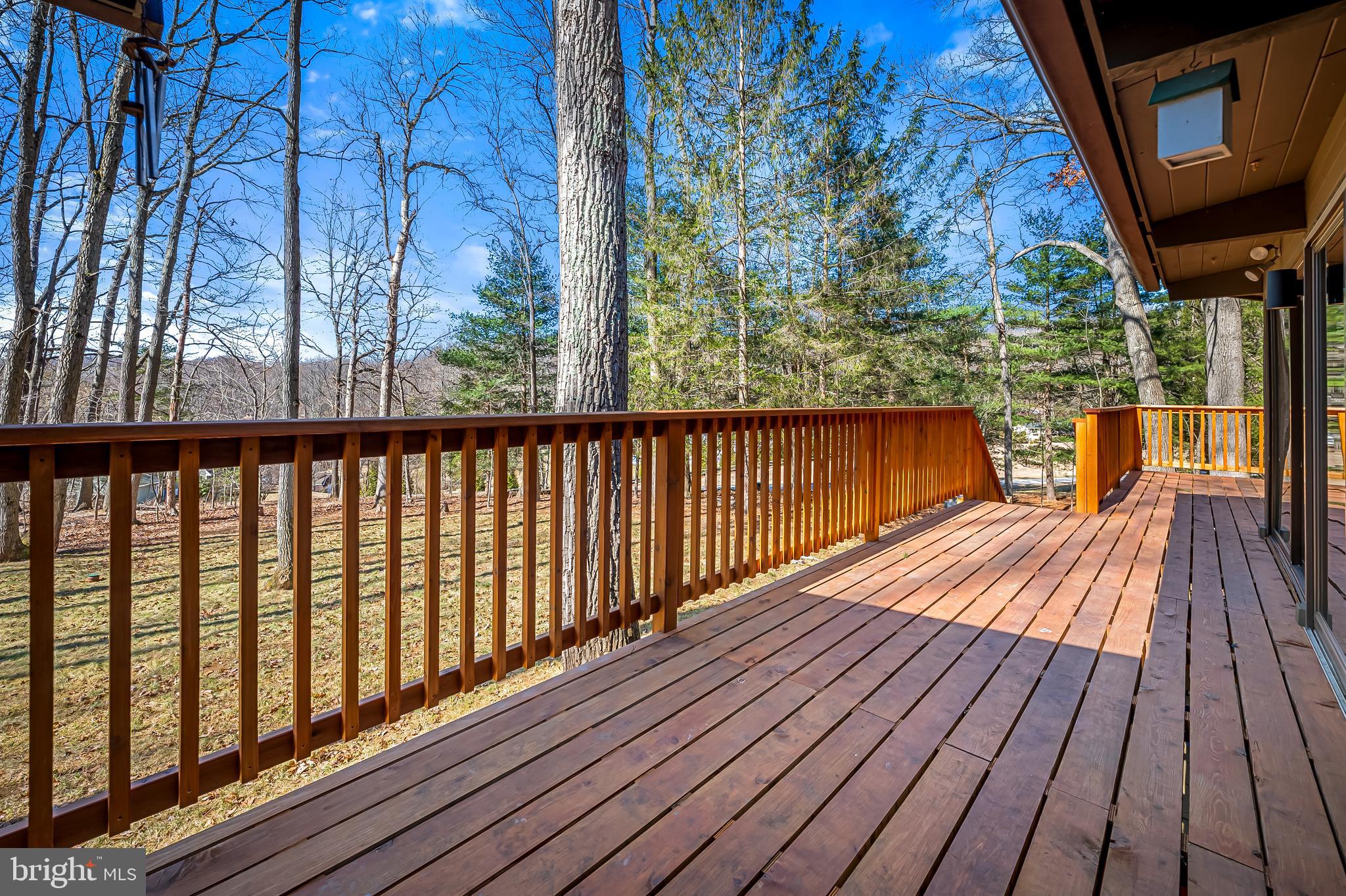 1817 Falls Road Parkton, MD 21120 - Photo 22 of 50 a balcony with wooden floor and fence