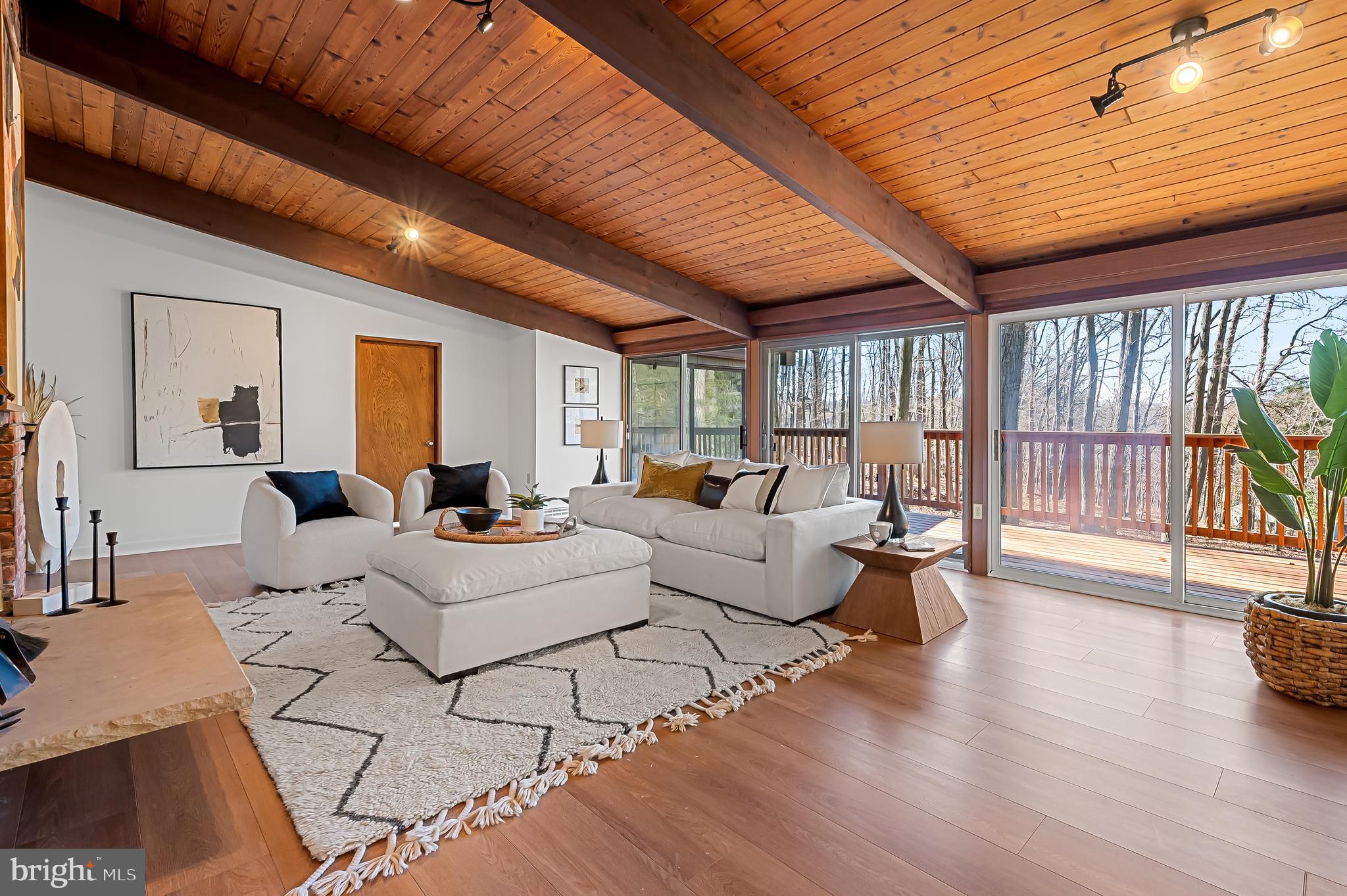 1817 Falls Road Parkton, MD 21120 - Photo 3 of 50 a living room with furniture a wooden floor and next to a window