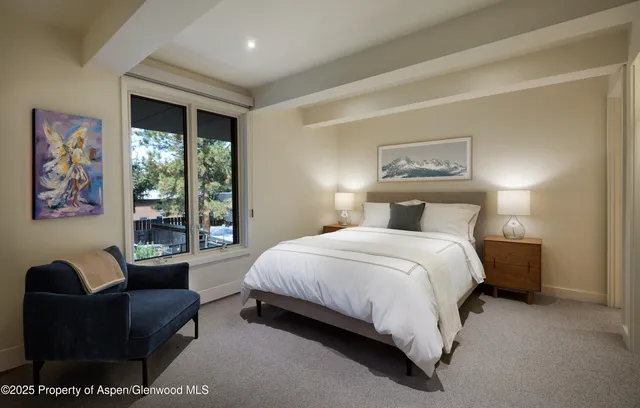 a bathroom with a tub a toilet and a sink