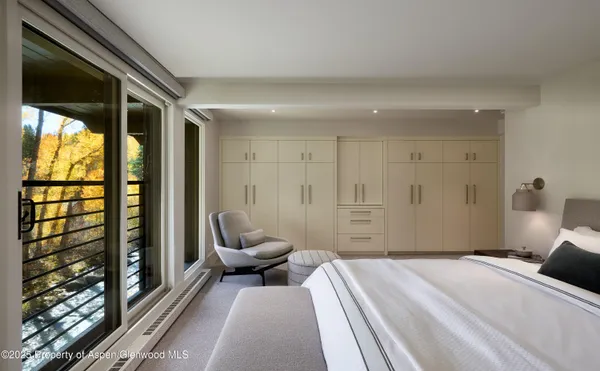 a bedroom with a bed and a walk in closet