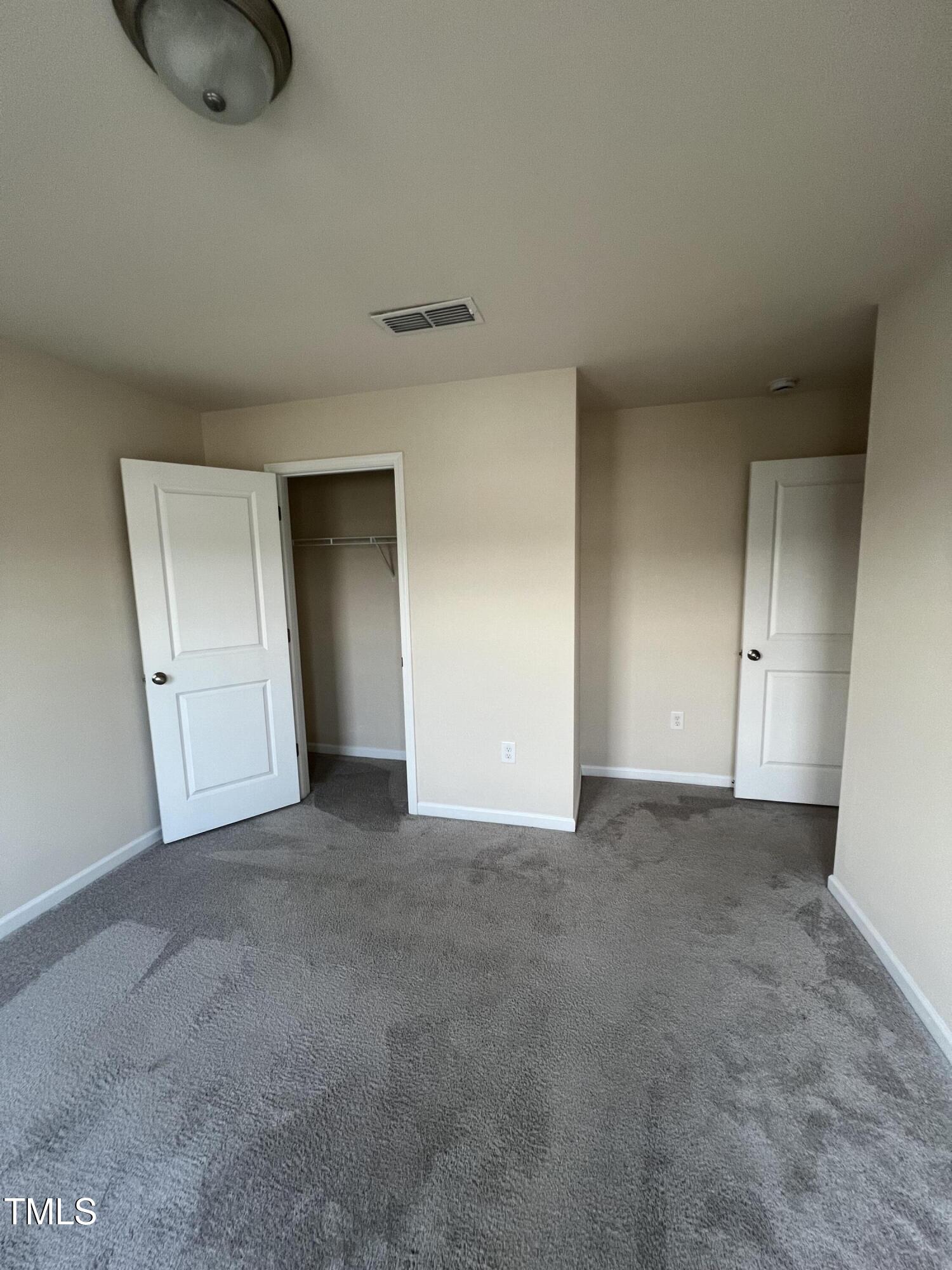 3529 Strawberry Patch Row Raleigh, NC 27604 - Photo 14 of 18 a view of an empty room and closet area