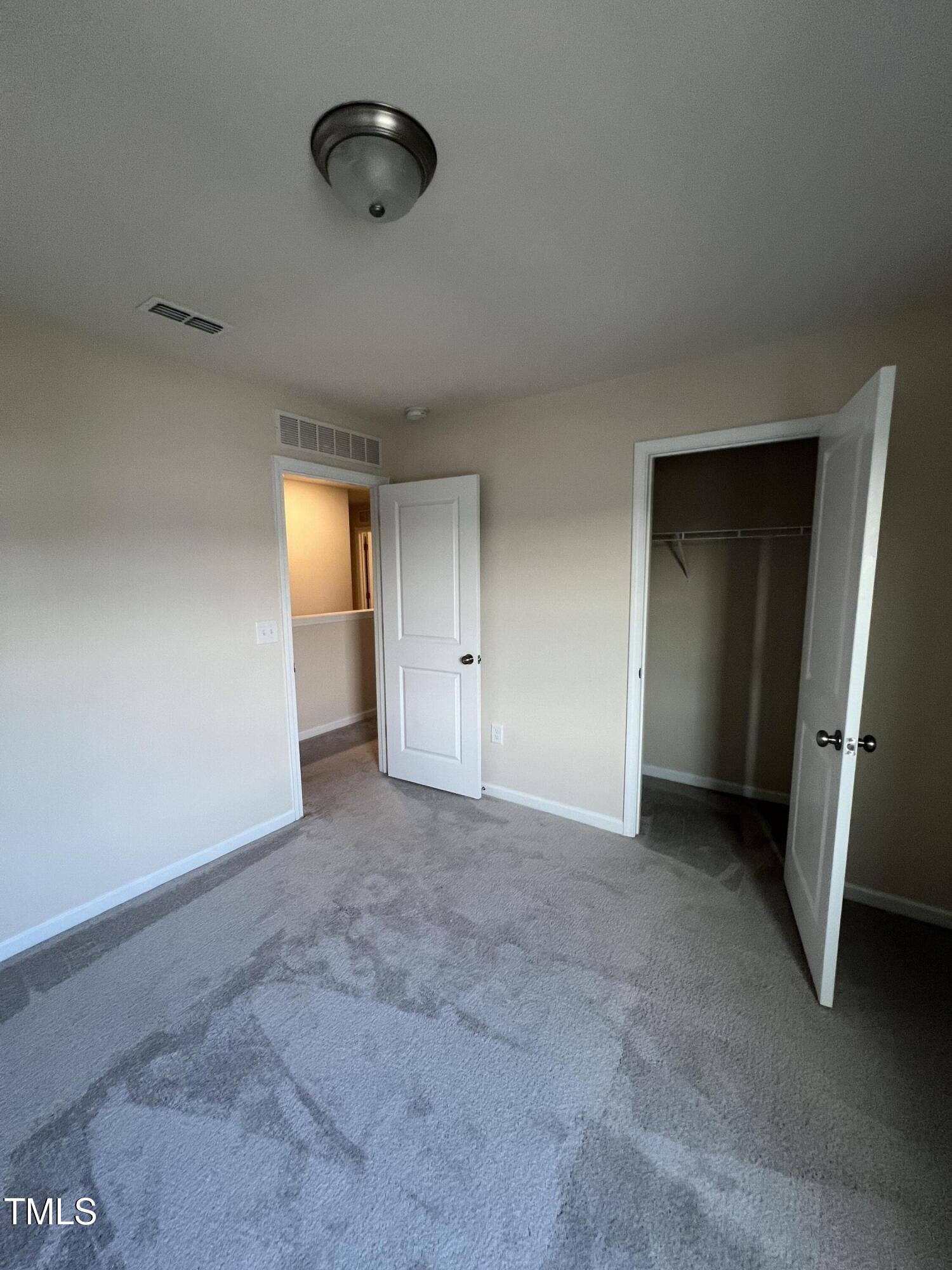 3529 Strawberry Patch Row Raleigh, NC 27604 - Photo 16 of 18 an empty room with an entryway and shower