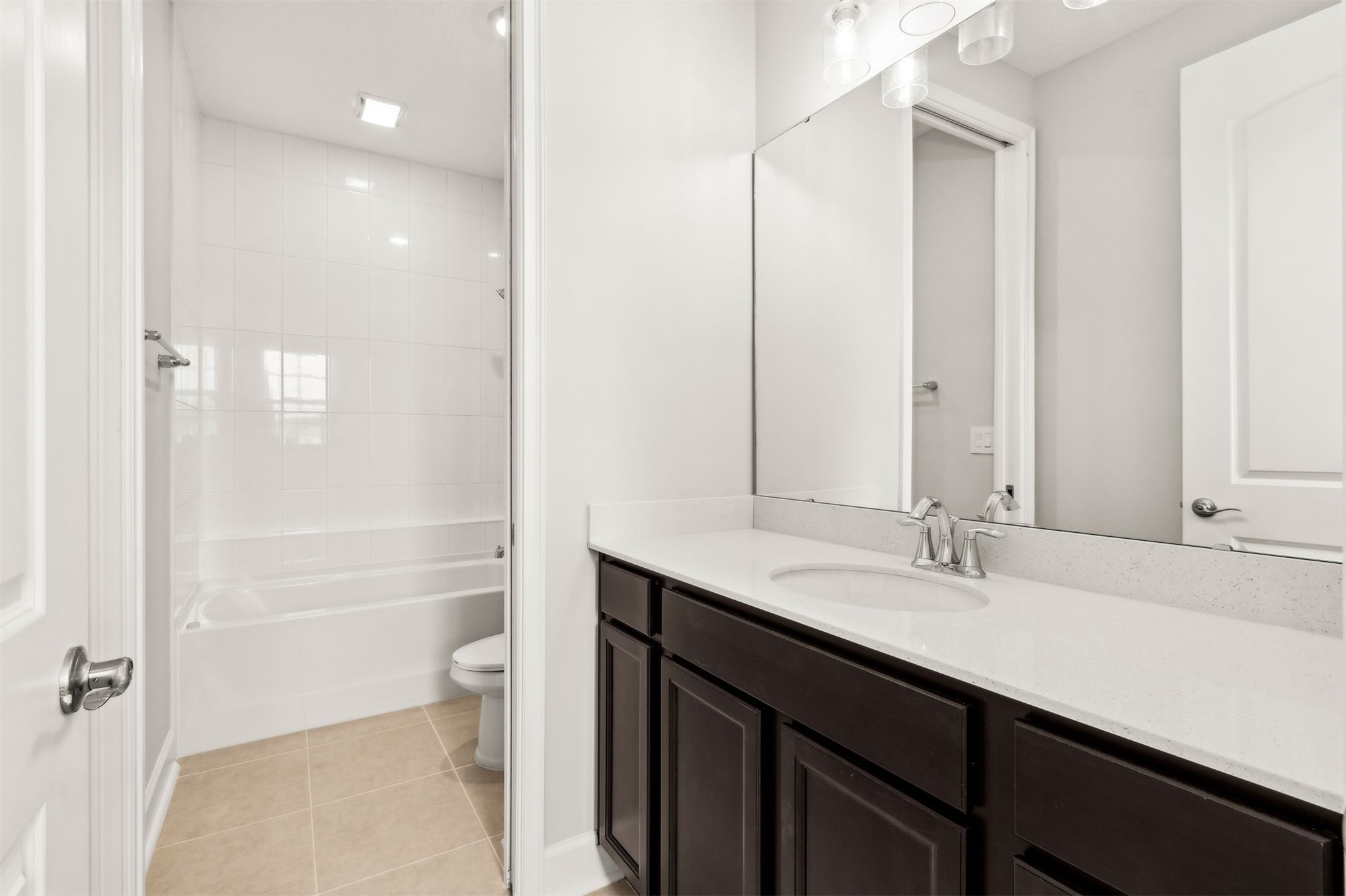 85236 Sandy Rdg Loop Yulee, FL 32097 - Photo 14 of 19 a bathroom with a double vanity sink toilet and shower
