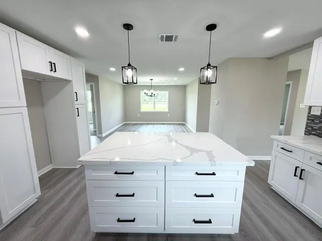 a fire hydrant in the middle of a field