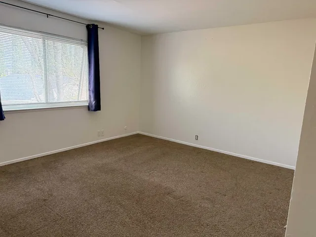 a view of entrance gate of house and trees
