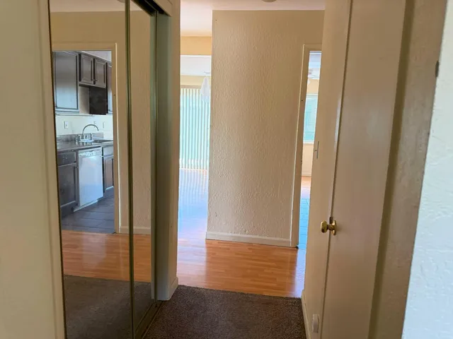 a view of a bathroom from a hallway