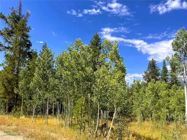 a view of a lake with a house in the background