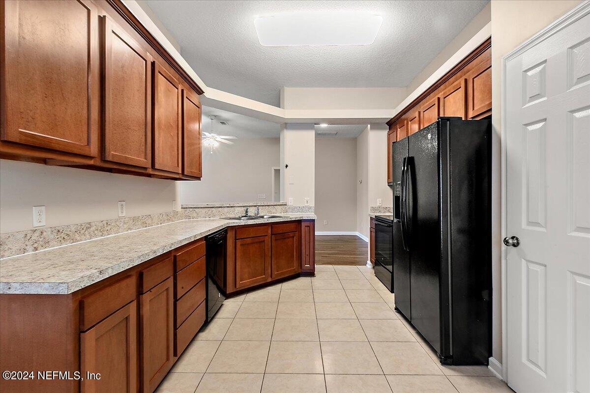 3022 Waters View Circle Orange Park, FL 32073 - Photo 11 of 17 a kitchen with stainless steel appliances granite countertop a refrigerator and a sink