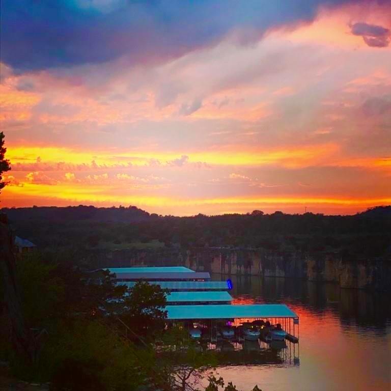 3123 Hells Gate Loop, Unit 45 Strawn, TX 76475 - Photo 24 of 30 a view of a lake with mountain in the background