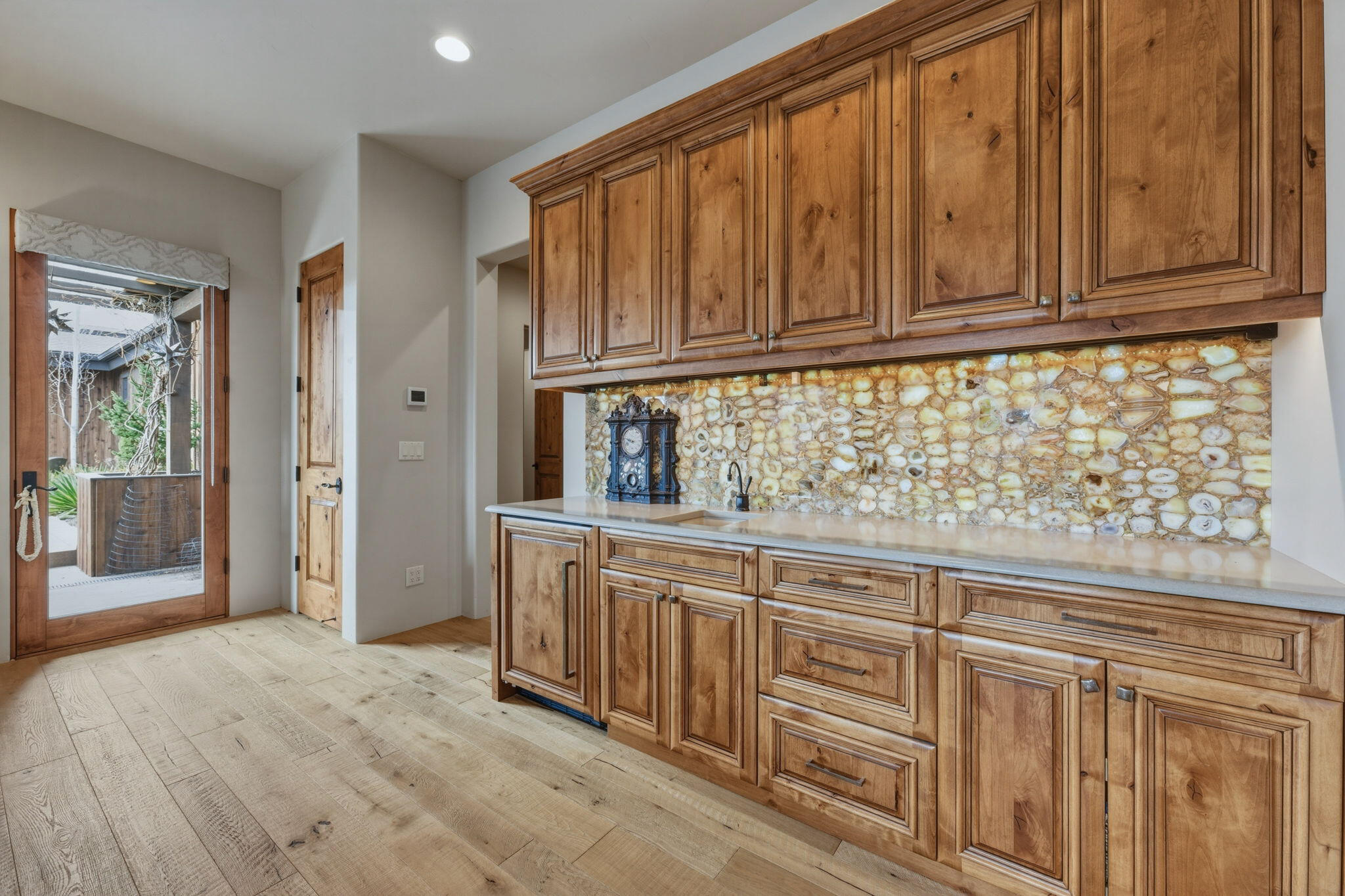 19100 Macalpine Loop Bend, OR 97702 - Photo 33 of 56 Media room - Onyx backsplash - built-in drink Cooler