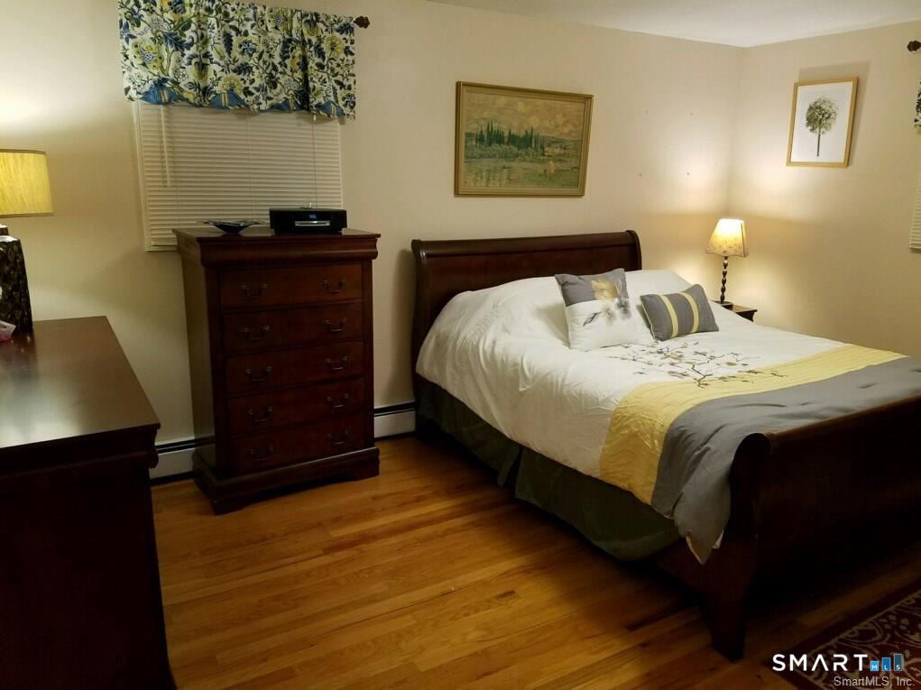 54 Berkshire Road West Hartford, CT 06107 - Photo 12 of 26 Spacious BR with hardwood floors.