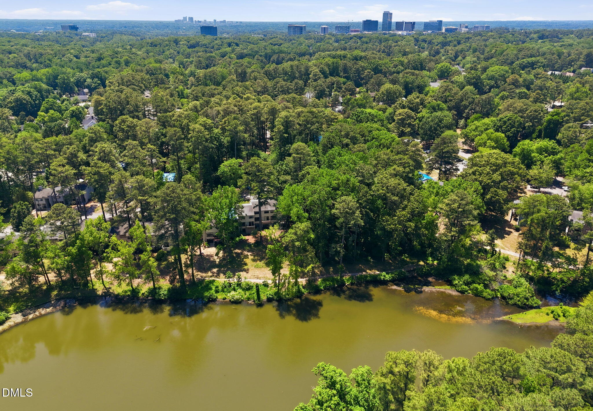 5043 Tall Pines Court Raleigh, NC 27609 - Photo 35 of 37 an aerial view of residential houses with outdoor space and lake view