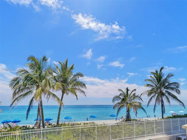 a view of outdoor space with palm trees
