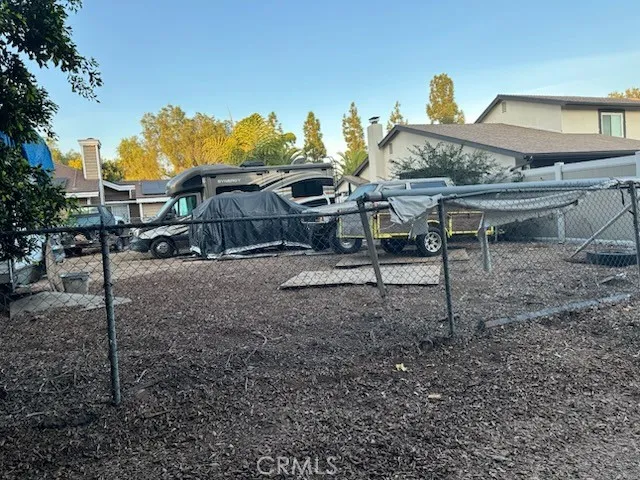 a view of a house with backyard space and porch
