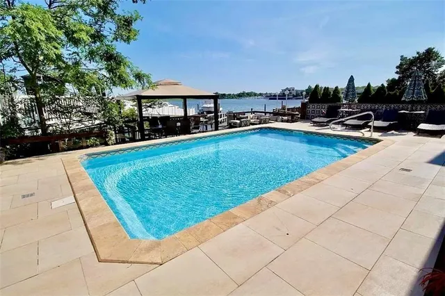 a view of swimming pool with chairs