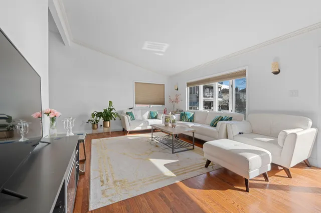 a living room with furniture and a table