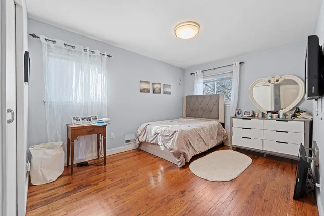 a bedroom with a bed and a dresser