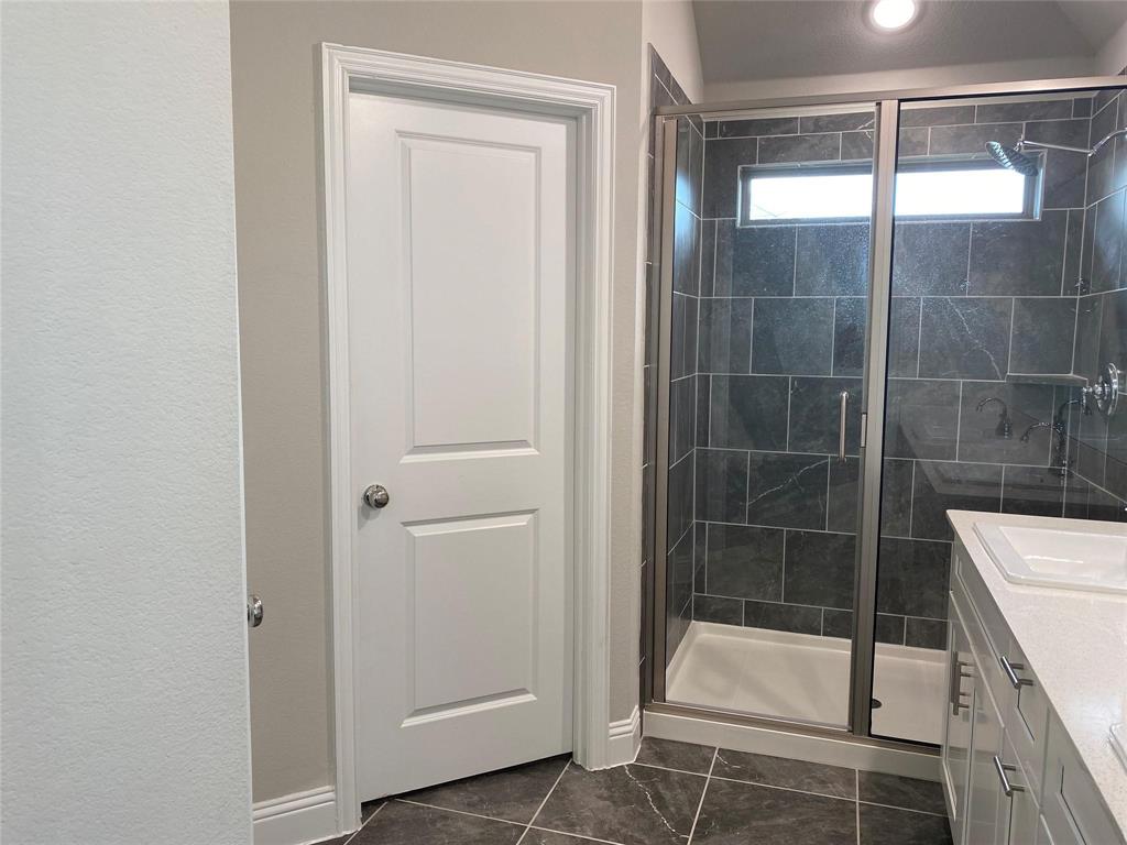 4162 Perch Drive Forney, TX 75126 - Photo 18 of 22 a bathroom with a shower and a sink