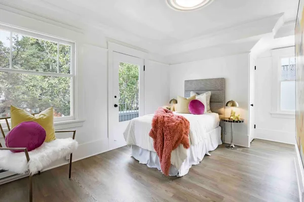 a bed room with a bed and a window