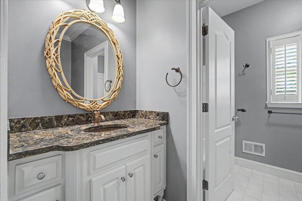 122 Ridge View Drive Ball Ground, GA 30107 - Photo 32 of 84 a bathroom with a granite countertop sink and a mirror