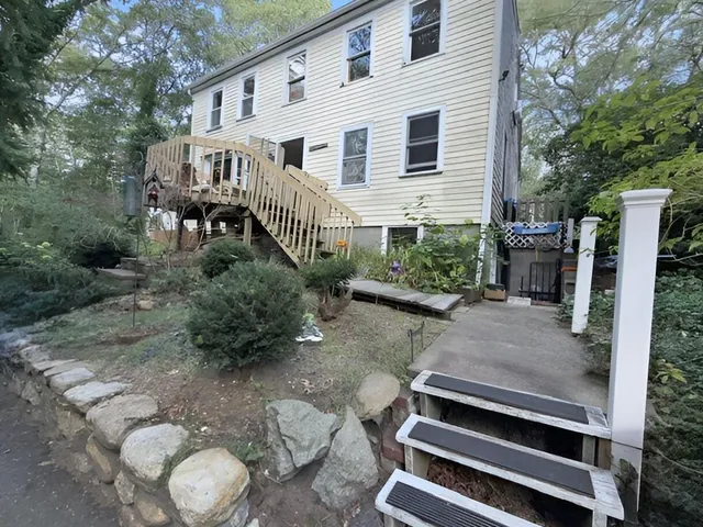 a front view of a house with garden