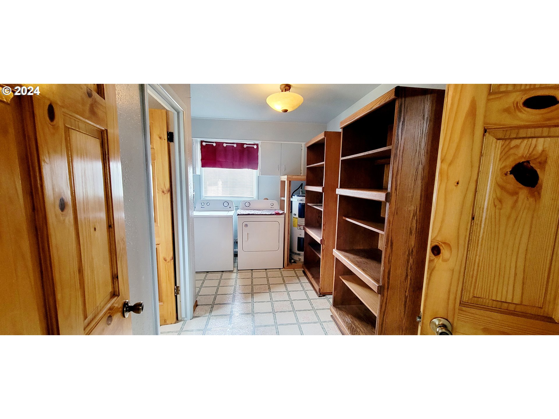 611 East 3rd Avenue Riddle, OR 97469 - Photo 11 of 42 a kitchen with stainless steel appliances a refrigerator and cabinets