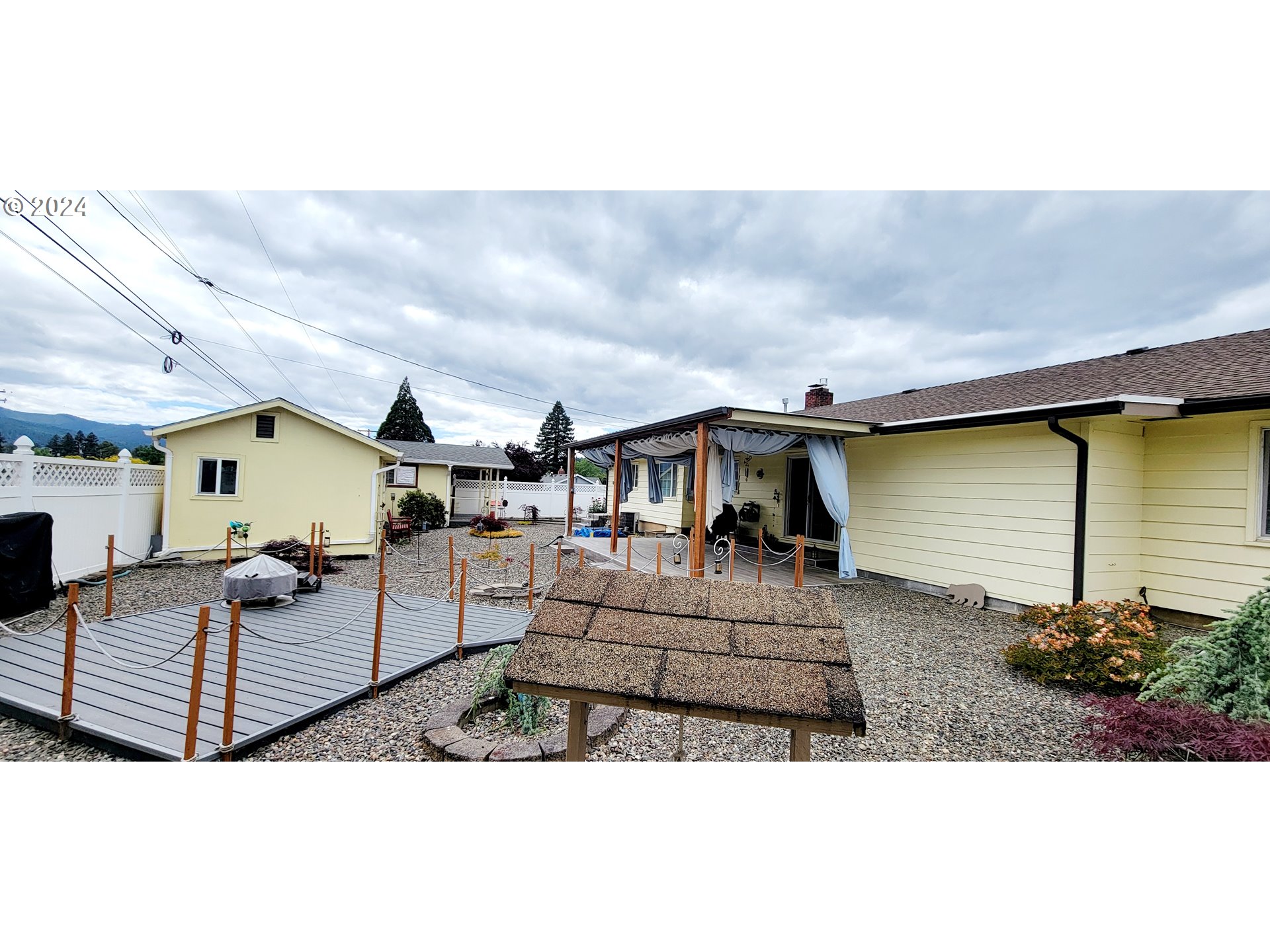 611 East 3rd Avenue Riddle, OR 97469 - Photo 33 of 42 a view of a house with a patio