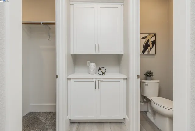 a bathroom with a toilet and a sink