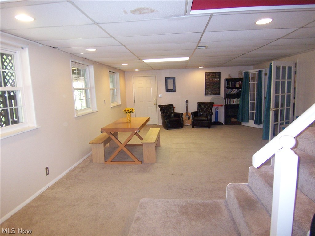 122 Rector Road Parkersburg, WV 26104 - Photo 24 of 35 Here is the other side of the Rec room located on the lower level. The 2 car garage is behind the door on the left.