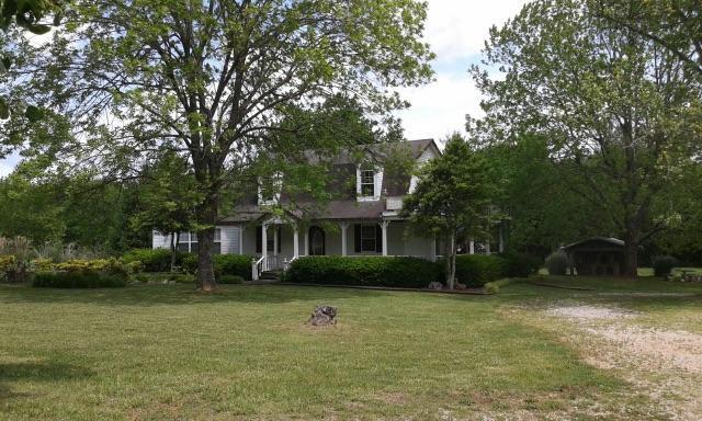 4896 Jacksboro Road Morrison, TN 37357 - Photo 1 of 21 a front view of a house with garden