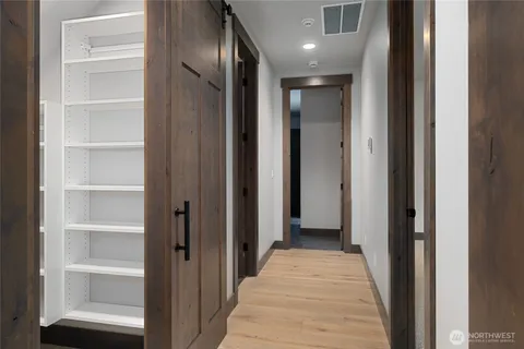 a view of a hallway with closet