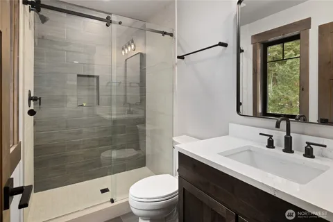 a bathroom with a toilet a sink and a bathtub