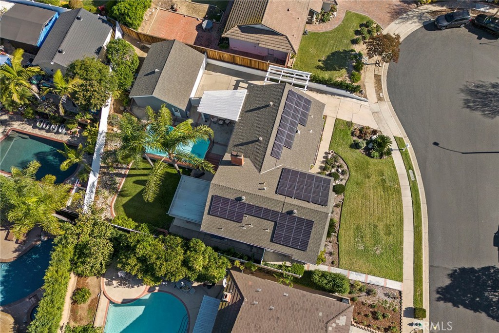 an aerial view of a house with a garden