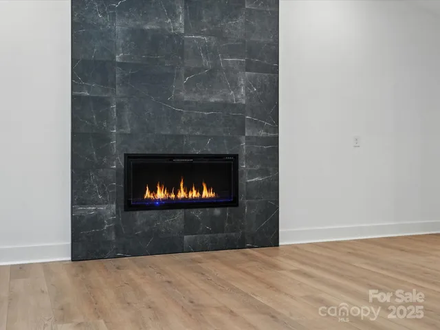 a bathroom with a shower sink and mirror