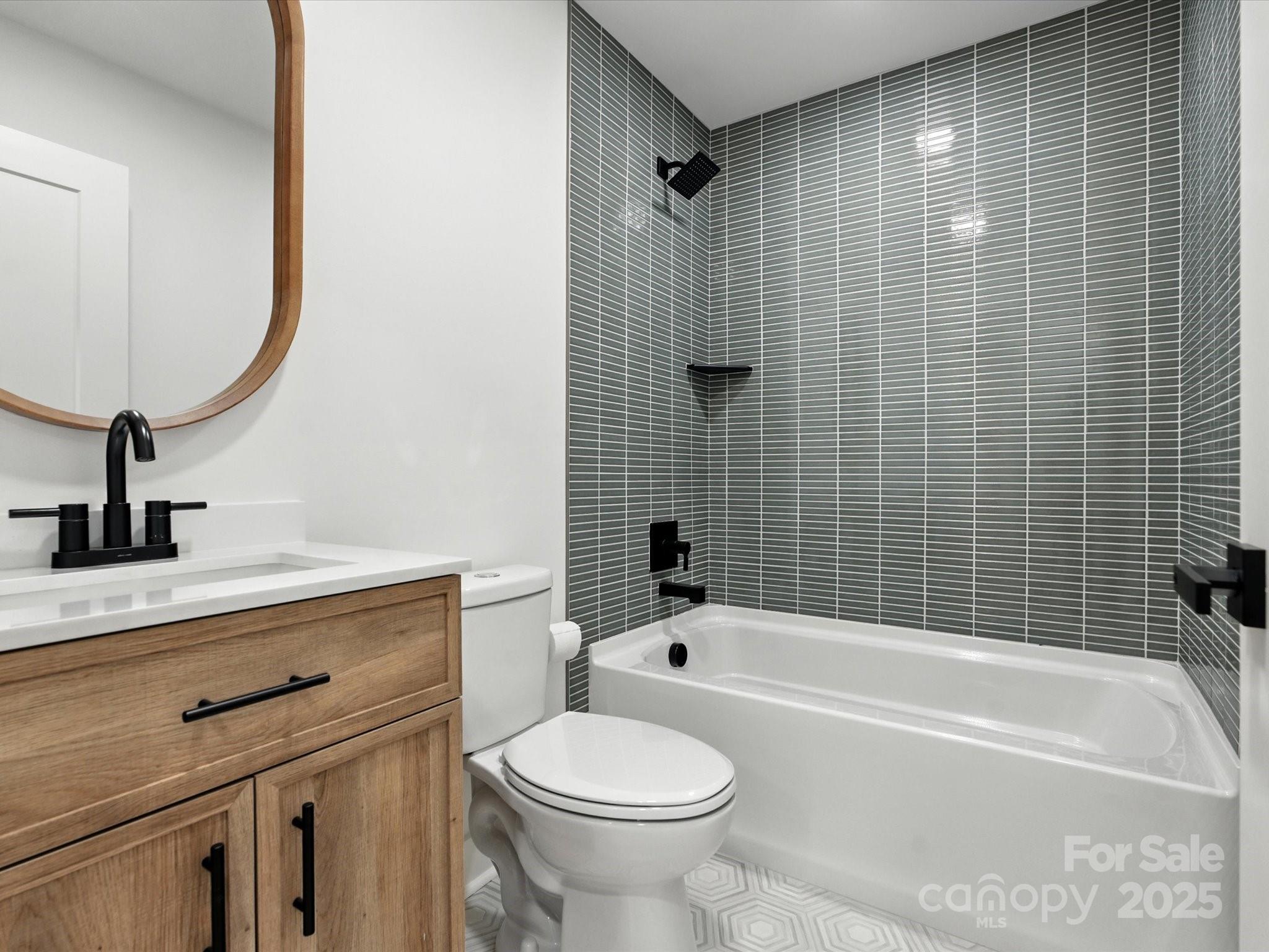 3303 Reid Circle Monroe, NC 28112 - Photo 21 of 44 a bathroom with a sink a toilet and shower