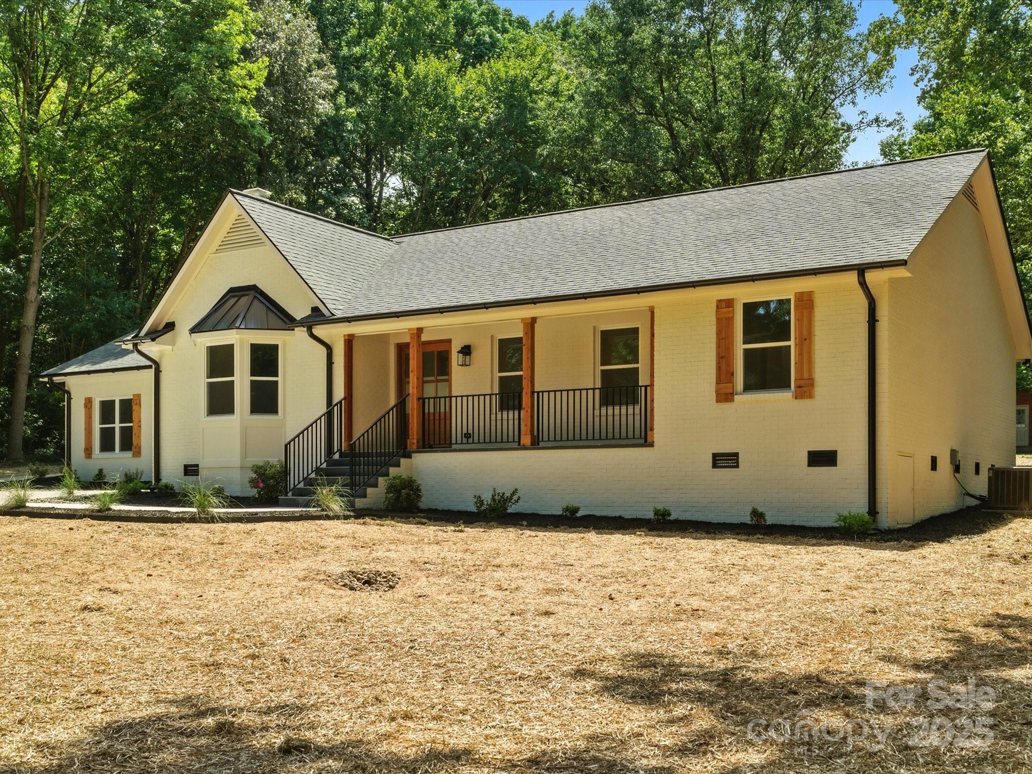3303 Reid Circle Monroe, NC 28112 - Photo 3 of 44 a front view of a house with a yard