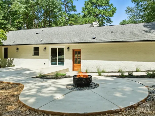 a house with swimming pool in front of it