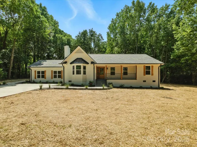 a house with trees in the background