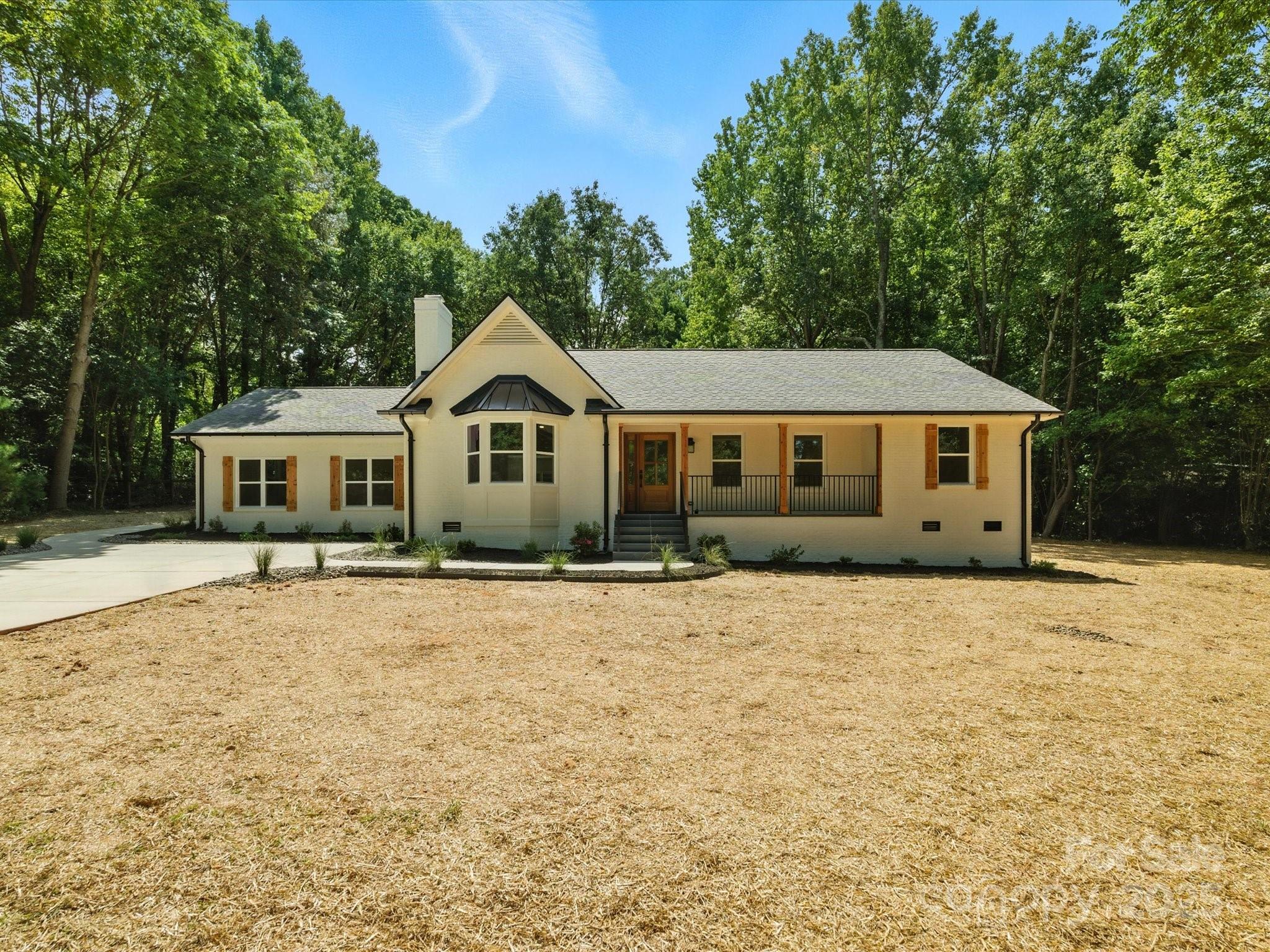 3303 Reid Circle Monroe, NC 28112 - Photo 37 of 44 a front view of a house with a yard