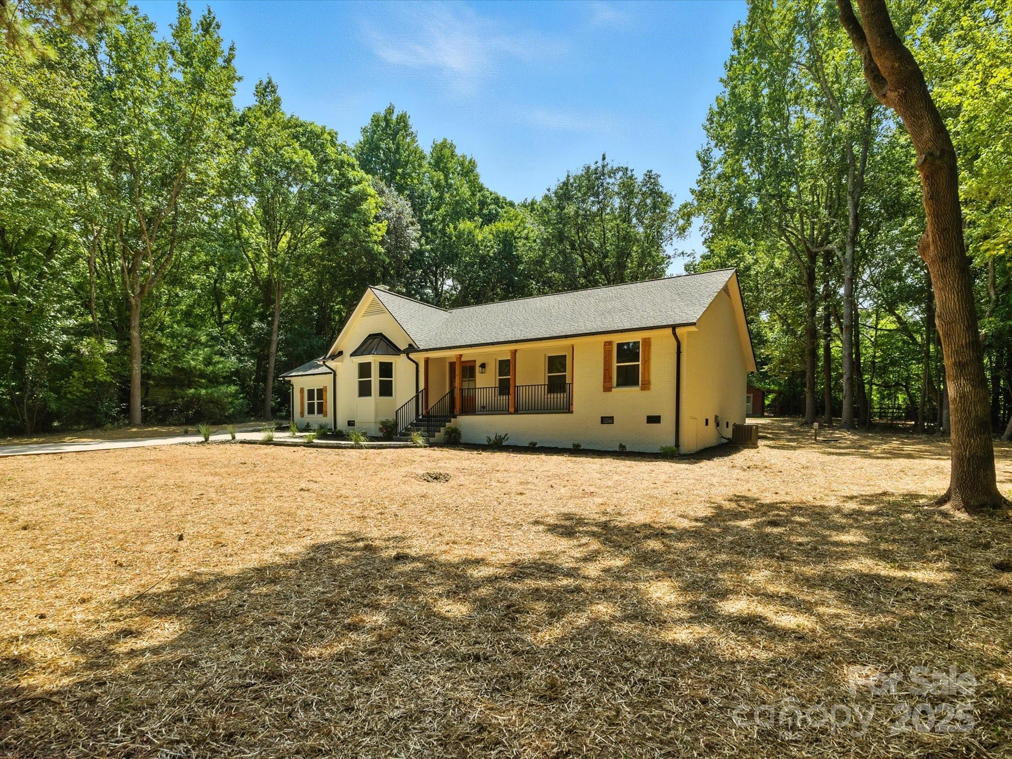 3303 Reid Circle Monroe, NC 28112 - Photo 39 of 44 a house with trees in the background