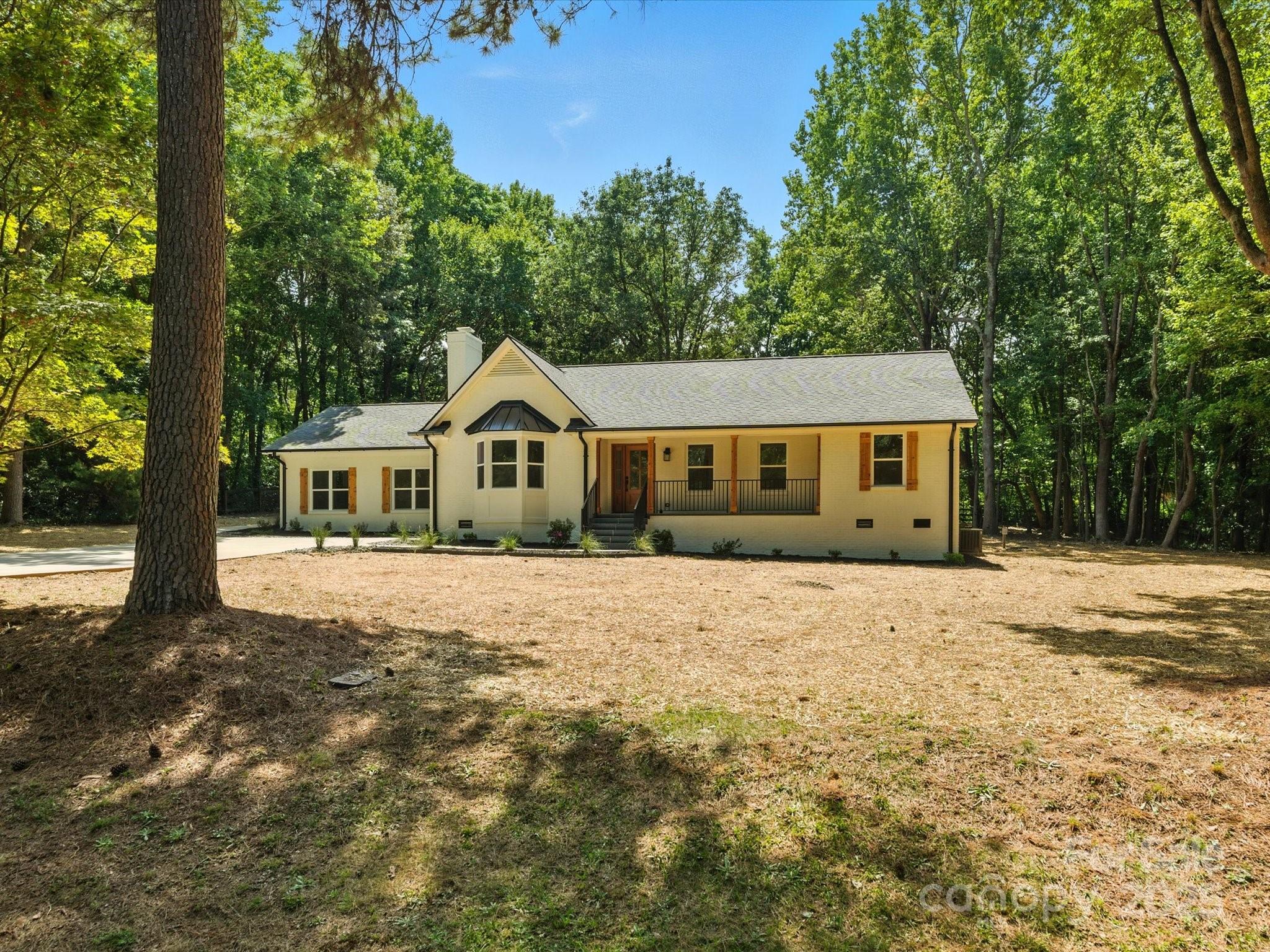 3303 Reid Circle Monroe, NC 28112 - Photo 40 of 44 a front view of a house with a yard and garage
