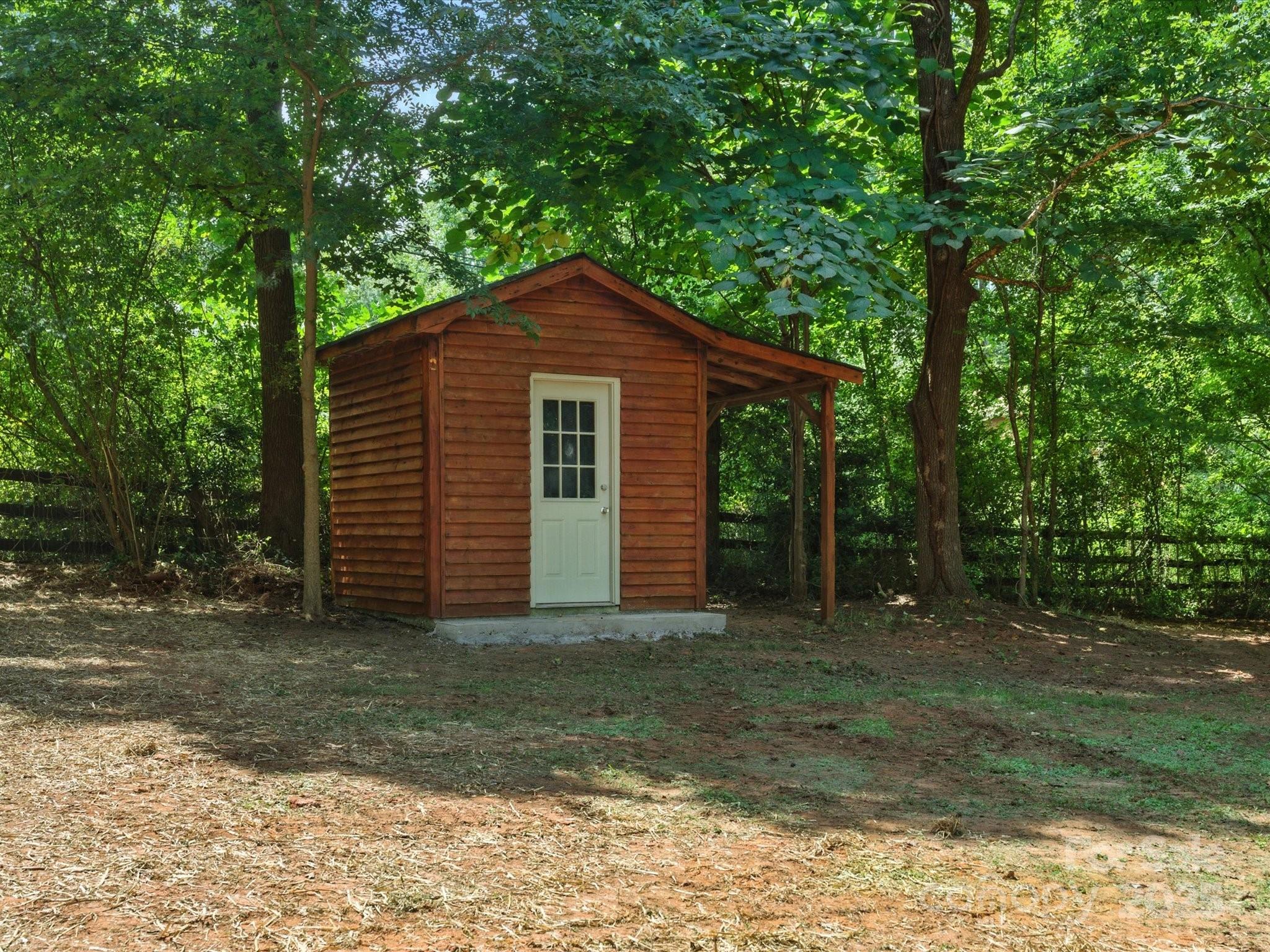 3303 Reid Circle Monroe, NC 28112 - Photo 42 of 44 a front view of a house with a garden