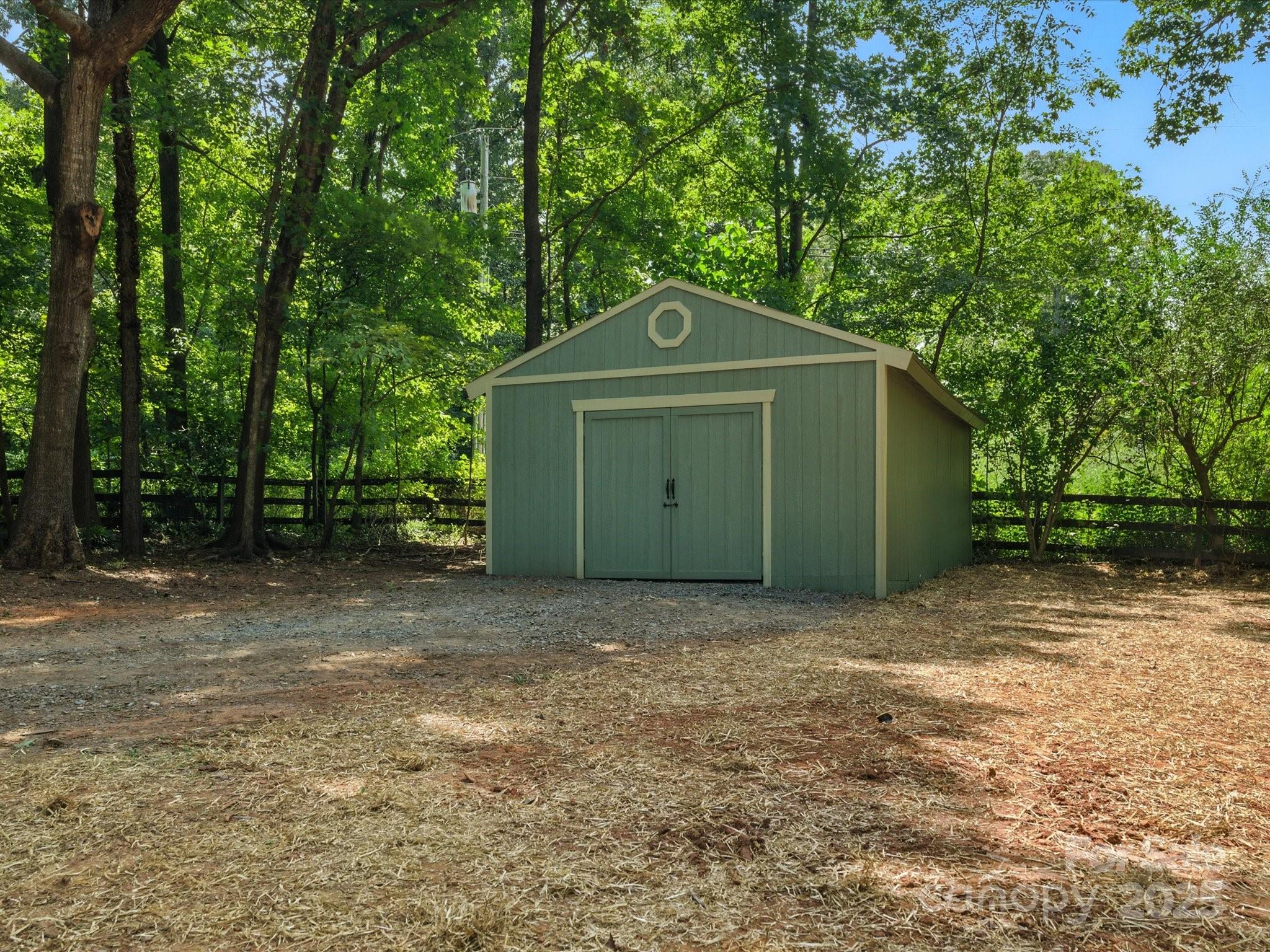 3303 Reid Circle Monroe, NC 28112 - Photo 43 of 44 a front view of a house with a yard and trees