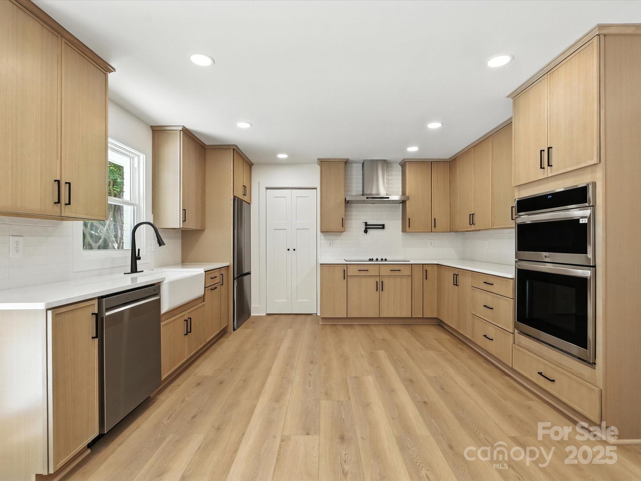 3303 Reid Circle Monroe, NC 28112 - Photo 5 of 44 a large kitchen with cabinets stainless steel appliances and a window